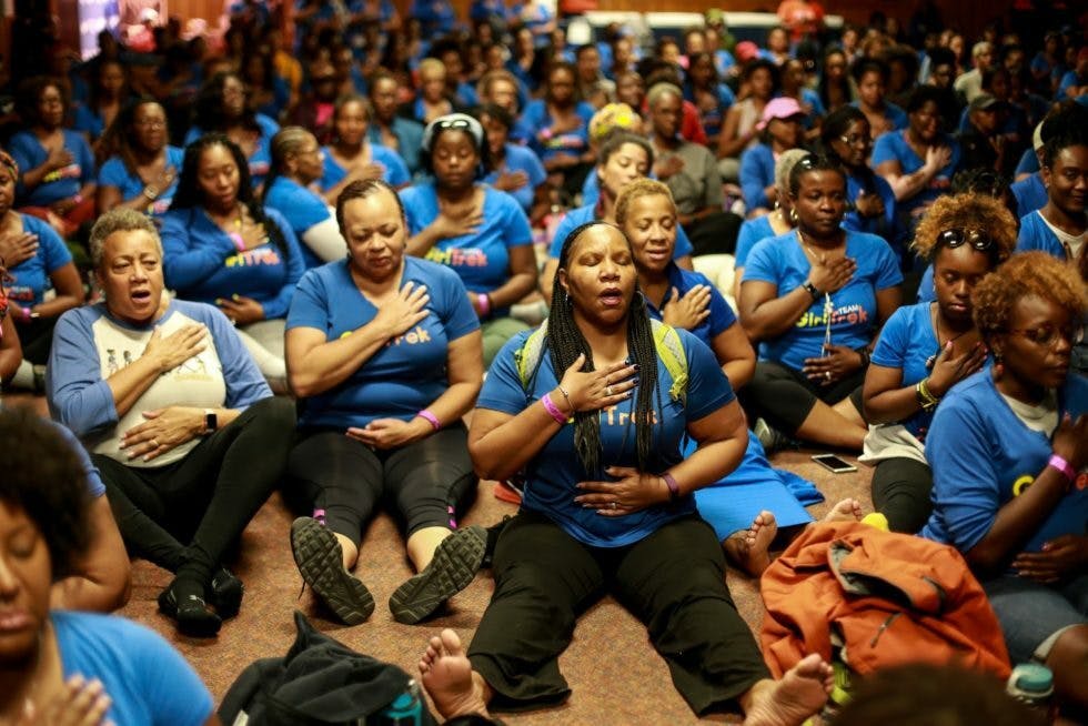 Participants at GirlTrek’s 2018 #StressProtest event, a “radical weekend of self-care” hosted in Estes Park, Colorado. Courtesy GirlTrek Flickr