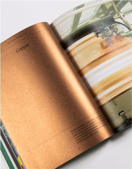 Pages from a magazine laid out on the floor